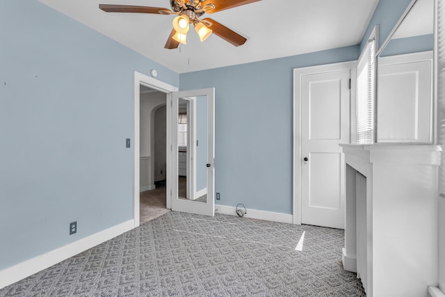 715 Ellery Ave, Jackson, MI 49202 - unfurnished bedroom with carpet floors and a ceiling fan