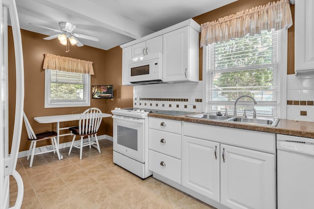 715 Ellery Ave, Jackson, MI 49202 - kitchen featuring white appliances, a ceiling fan, plenty of natural light, and white cabinetry