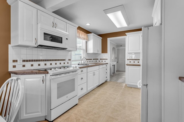 715 Ellery Ave, Jackson, MI 49202 - kitchen featuring white appliances, decorative backsplash, white cabinetry, and recessed lighting