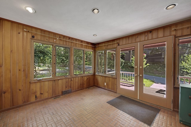 99 Tahoma Trl, New Buffalo, MI 49117 - unfurnished sunroom featuring brick patterned flooring, wood walls, french doors, and recessed lighting