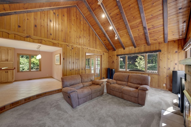 99 Tahoma Trl, New Buffalo, MI 49117 - living area featuring a wood ceiling with exposed beams, wood walls, light carpet, and high vaulted ceiling