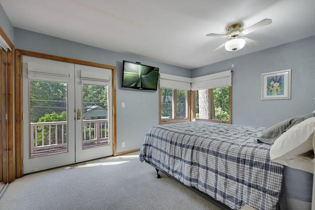 99 Tahoma Trl, New Buffalo, MI 49117 - carpeted bedroom with access to exterior, multiple windows, french doors, and a ceiling fan