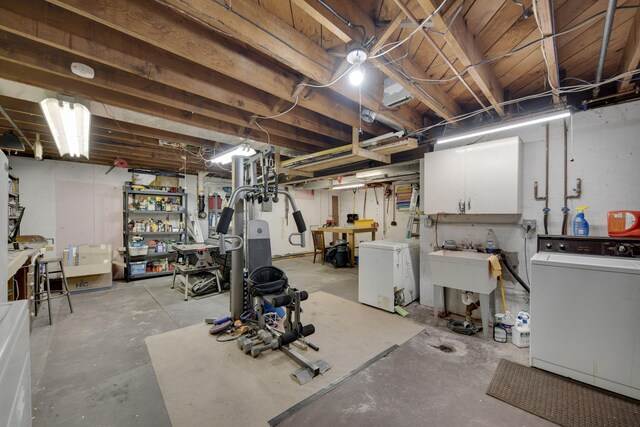 99 Tahoma Trl, New Buffalo, MI 49117 - unfinished basement featuring washing machine and dryer and a workshop area
