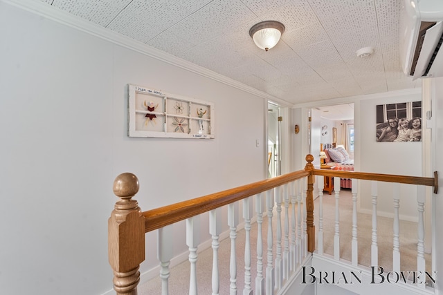2625 Elmwood Dr, Pierson, MI 49339 - corridor featuring an upstairs landing, a wall mounted air conditioner, and crown molding