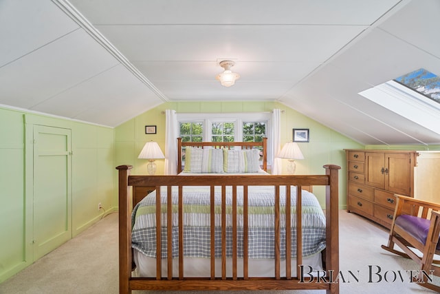 2625 Elmwood Dr, Pierson, MI 49339 - bedroom with lofted ceiling, light carpet, and a skylight