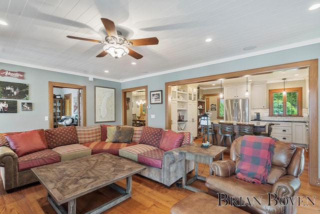 2625 Elmwood Dr, Pierson, MI 49339 - living area featuring light wood finished floors, ceiling fan, recessed lighting, and crown molding