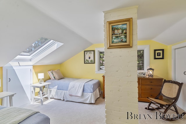 2625 Elmwood Dr, Pierson, MI 49339 - bedroom featuring a skylight, lofted ceiling, and carpet flooring