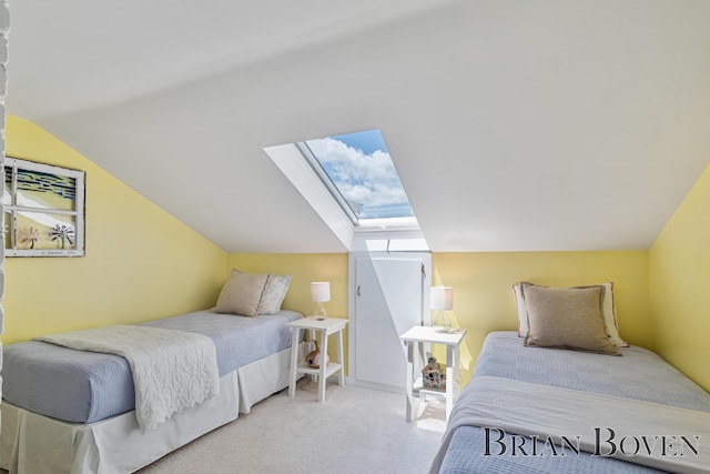 2625 Elmwood Dr, Pierson, MI 49339 - bedroom featuring a skylight, vaulted ceiling, and carpet