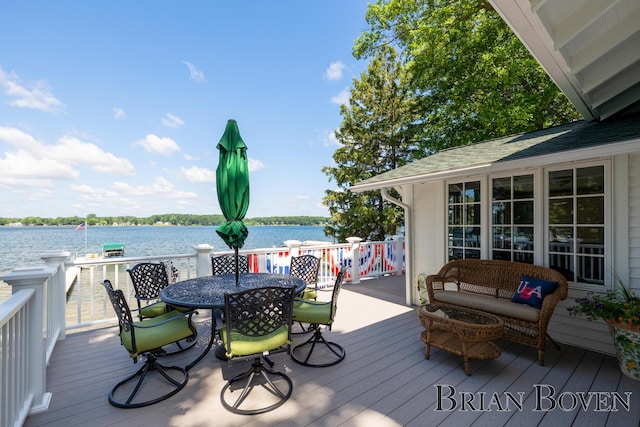 2625 Elmwood Dr, Pierson, MI 49339 - deck with a water view and outdoor dining area
