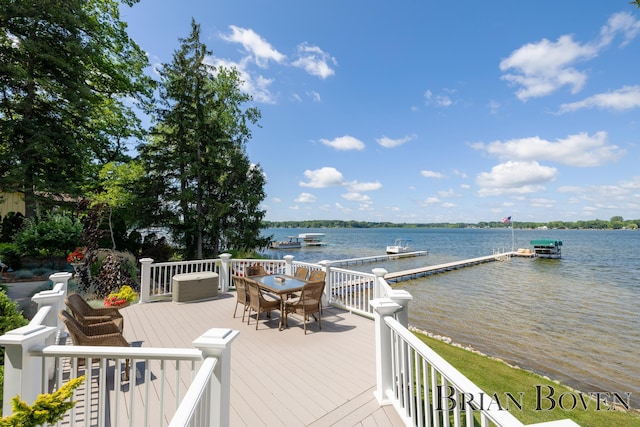 2625 Elmwood Dr, Pierson, MI 49339 - wooden deck with a water view and a floating dock