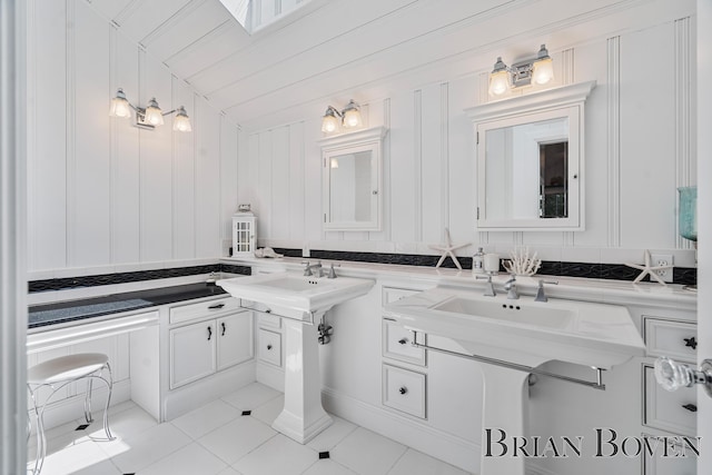 2625 Elmwood Dr, Pierson, MI 49339 - bathroom with tile patterned flooring and a decorative wall