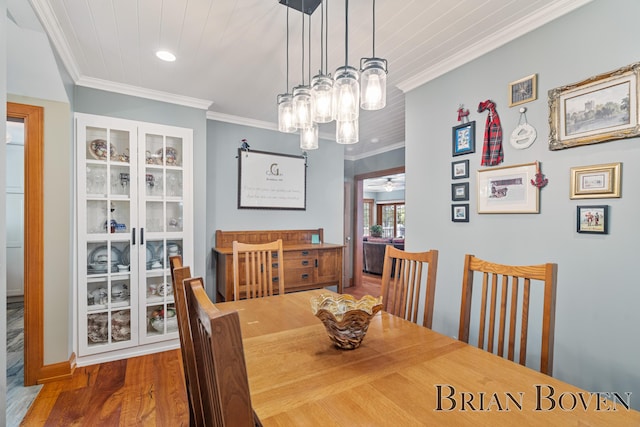 2625 Elmwood Dr, Pierson, MI 49339 - dining space with wood finished floors, a chandelier, crown molding, and recessed lighting