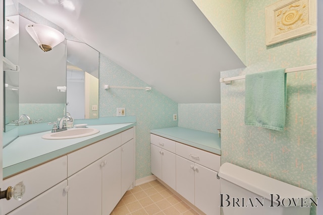 2625 Elmwood Dr, Pierson, MI 49339 - bathroom with wallpapered walls, vanity, lofted ceiling, and tile patterned floors