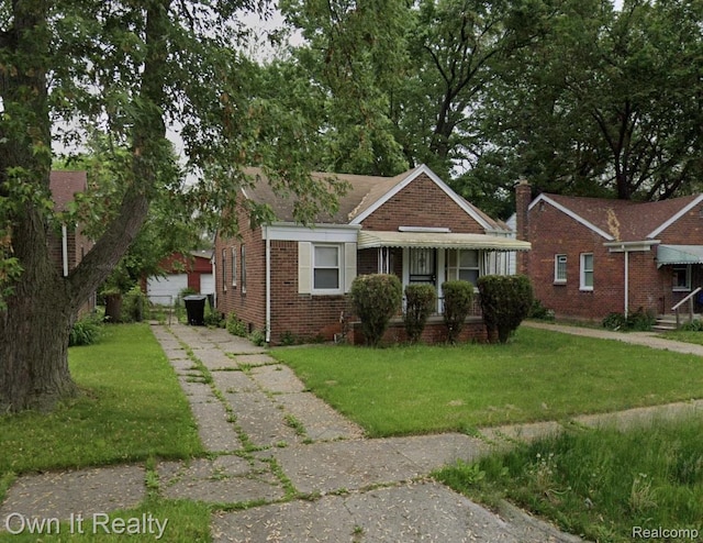 18287 Gilchrist St, Detroit, MI 48235 - bungalow-style house featuring brick siding and a front lawn