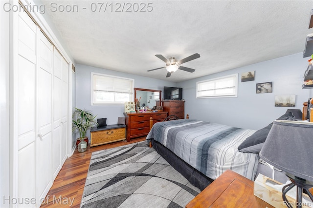 36827 Weideman, Clinton Township, MI 48035 - bedroom featuring a closet, wood finished floors, a textured ceiling, and a ceiling fan
