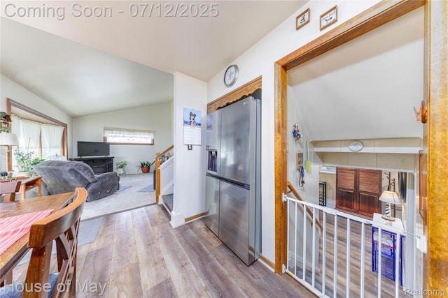 36827 Weideman, Clinton Township, MI 48035 - kitchen with stainless steel refrigerator with ice dispenser, lofted ceiling, and wood finished floors