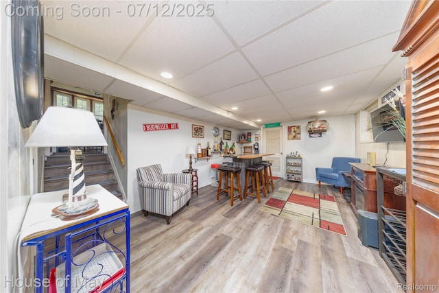 36827 Weideman, Clinton Township, MI 48035 - living room with wood finished floors, a drop ceiling, stairway, and recessed lighting