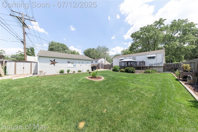 36827 Weideman, Clinton Township, MI 48035 - fenced backyard with a storage unit and a wooden deck
