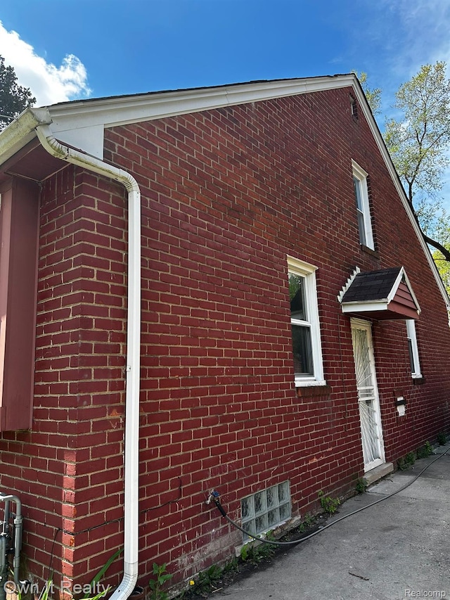 19505 Sunderland Rd, Detroit, MI 48219 - view of side of home with brick siding