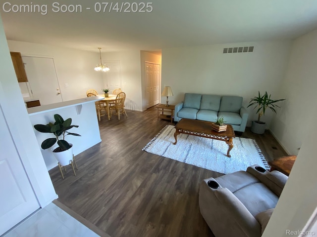 1093 Lake Park Cir Unit 6, Grand Blanc, MI 48439 - living area with a chandelier and dark wood finished floors