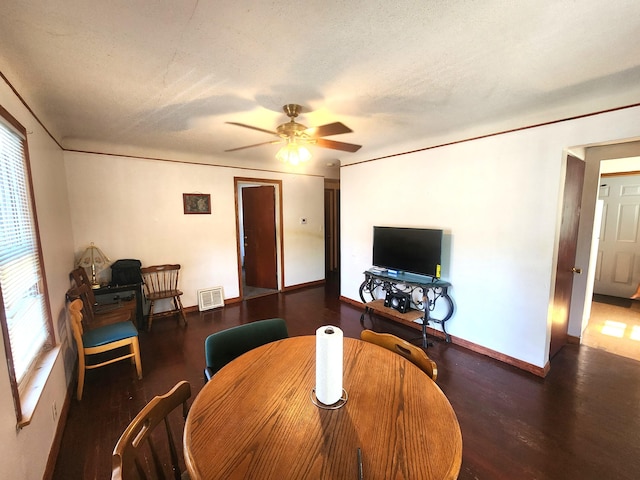 2258 Mckee Ave SW, Grand Rapids, MI 49503 - dining room featuring wood finished floors, a ceiling fan, and a textured ceiling