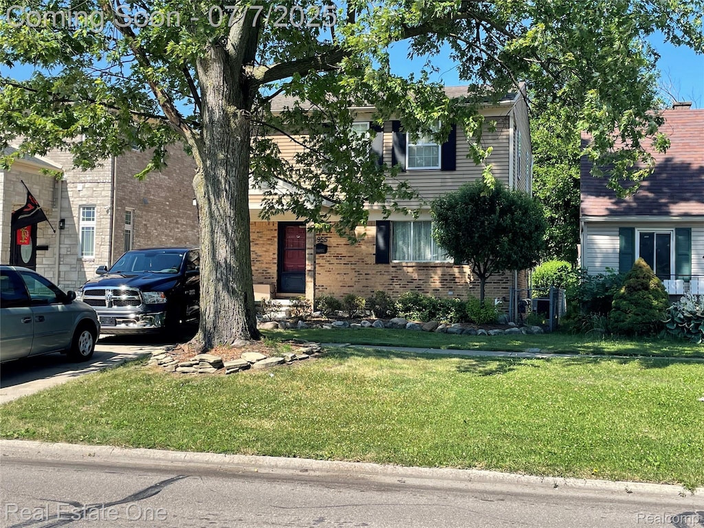 5955 Beech Daly Rd, Dearborn Heights, MI 48127 - view of front facade featuring a front lawn and brick siding