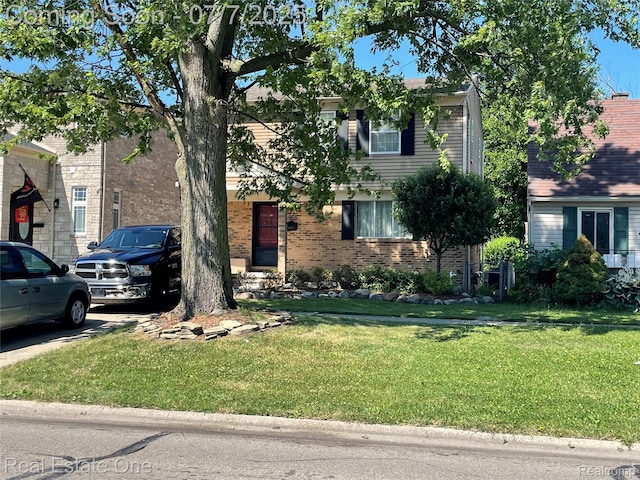 5955 Beech Daly Rd, Dearborn Heights, MI 48127 - view of front facade featuring a front lawn and brick siding