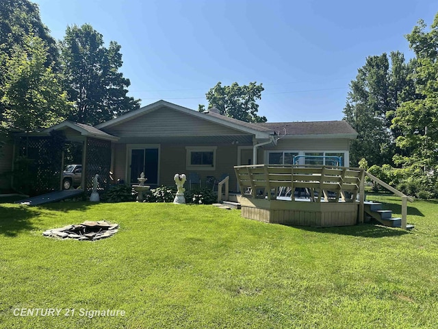 324 Pine St, Clio, MI 48420 - rear view of property featuring a yard and a wooden deck