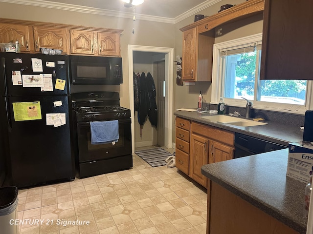 324 Pine St, Clio, MI 48420 - kitchen featuring black appliances, dark countertops, crown molding, and brown cabinetry