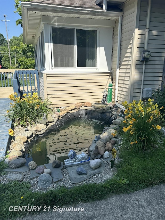 324 Pine St, Clio, MI 48420 - view of home's exterior featuring a garden pond