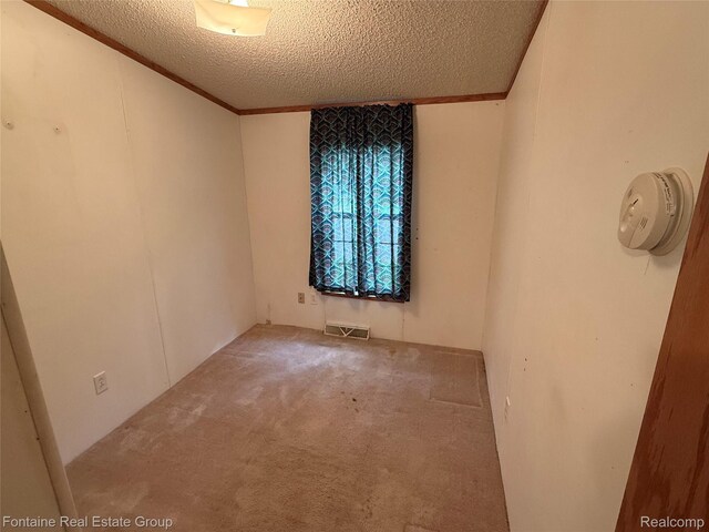 26852 Roric St, Novi, MI 48377 - carpeted spare room featuring a textured ceiling and a smoke detector