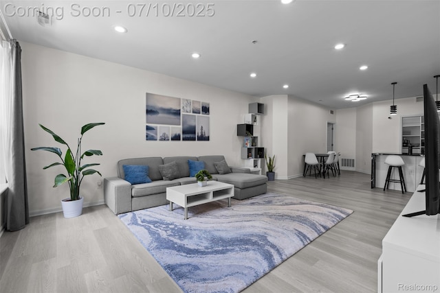 8461 Towne Center Cir N, Warren, MI 48093 - living area featuring light wood-style floors and recessed lighting