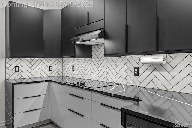 8461 Towne Center Cir N, Warren, MI 48093 - kitchen featuring range hood, dark cabinetry, dark countertops, white cabinetry, and decorative backsplash