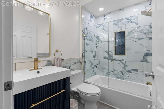 8461 Towne Center Cir N, Warren, MI 48093 - bathroom featuring vanity, shower / tub combination, tile walls, and wainscoting