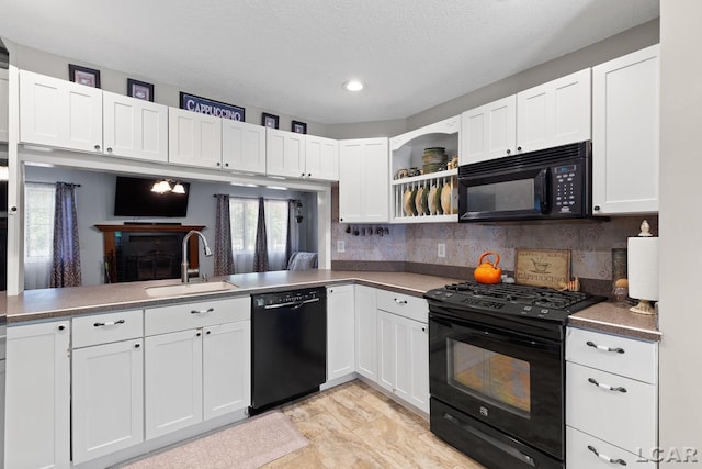 15858 Lelah Ln, Addison, MI 49220 - kitchen with black appliances, white cabinets, open shelves, decorative backsplash, and recessed lighting