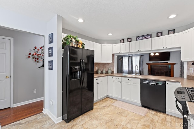 15858 Lelah Ln, Addison, MI 49220 - kitchen featuring black appliances, light countertops, white cabinets, decorative backsplash, and recessed lighting