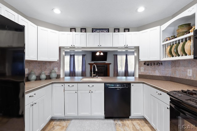 15858 Lelah Ln, Addison, MI 49220 - kitchen featuring black appliances, healthy amount of natural light, white cabinetry, backsplash, and recessed lighting