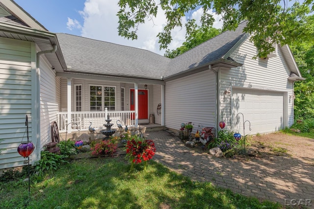 15858 Lelah Ln, Addison, MI 49220 - view of front of home featuring a porch, a shingled roof, dirt driveway, and a garage