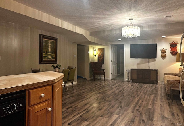 15858 Lelah Ln, Addison, MI 49220 - living area featuring dark wood-style flooring and a chandelier