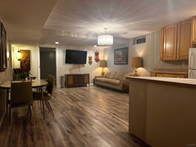 15858 Lelah Ln, Addison, MI 49220 - living area with dark wood-style flooring and a chandelier