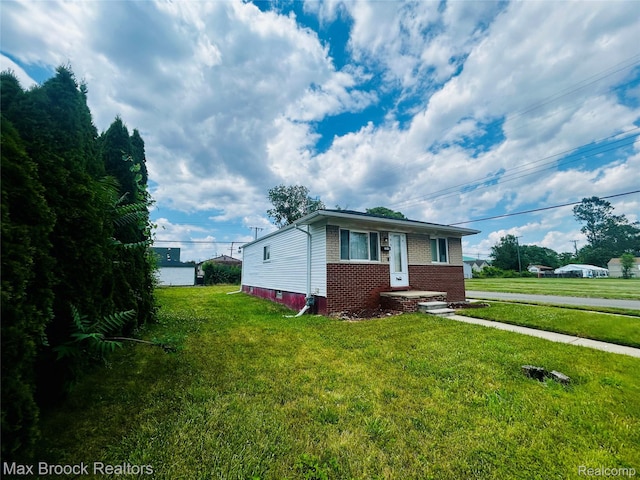 3948 10th St, Ecorse, MI 48229 - view of front of property with brick siding and a front yard