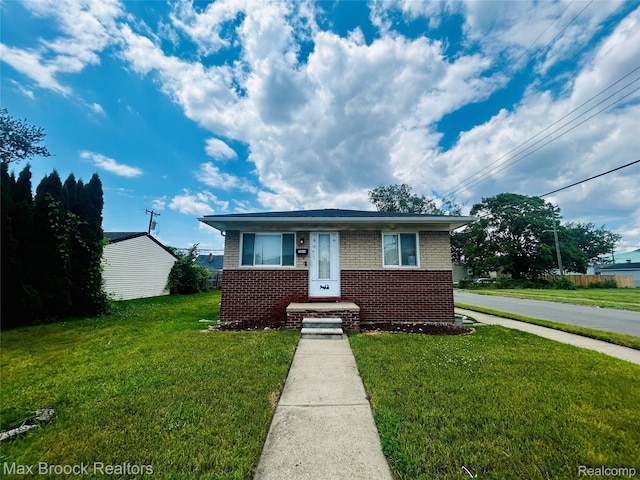3948 10th St, Ecorse, MI 48229 - bungalow-style house featuring brick siding and a front yard