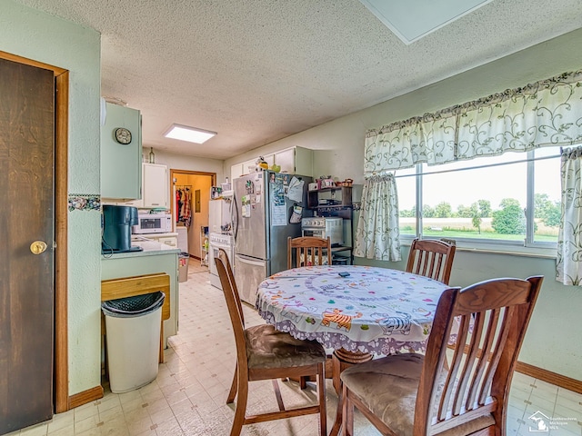 12388 N Suder Rd, La Salle, MI 48145 - dining area featuring a textured ceiling and light flooring