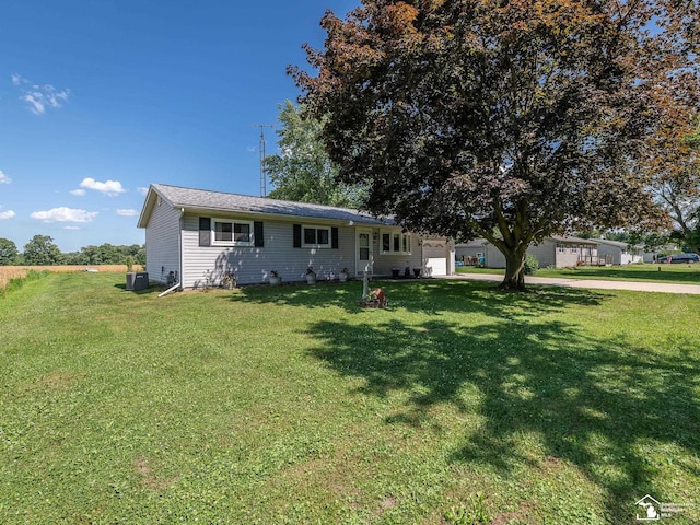 12388 N Suder Rd, La Salle, MI 48145 - single story home with a garage, a front yard, and concrete driveway