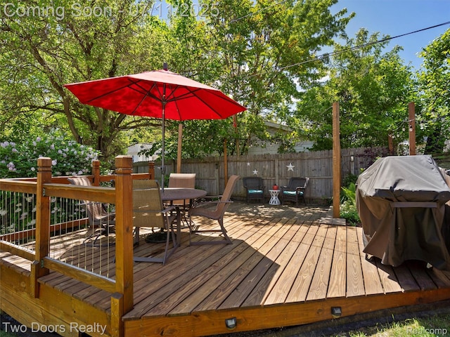 30 Beebe St, Lake Orion, MI 48362 - wooden deck with outdoor dining space and a grill