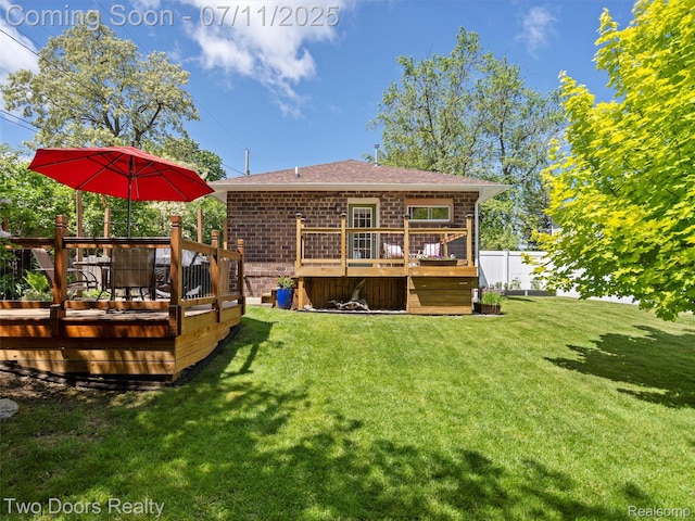 30 Beebe St, Lake Orion, MI 48362 - back of property featuring a wooden deck, a shingled roof, and brick siding