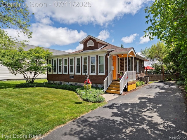 30 Beebe St, Lake Orion, MI 48362 - view of front of house with driveway and a shingled roof