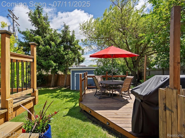 30 Beebe St, Lake Orion, MI 48362 - wooden terrace with a fenced backyard, a storage unit, and outdoor dining space