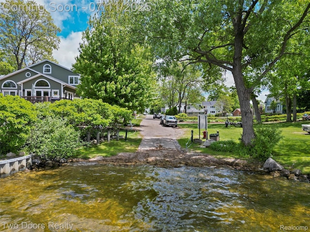 30 Beebe St, Lake Orion, MI 48362 - view of property's community with a lawn