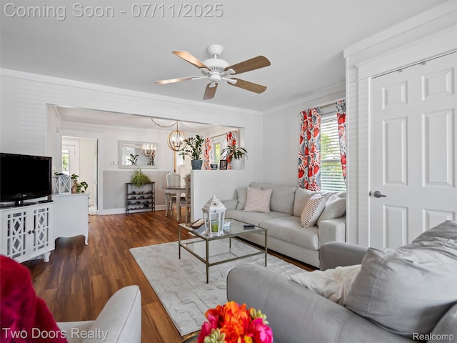 30 Beebe St, Lake Orion, MI 48362 - living room featuring ornamental molding, a ceiling fan, healthy amount of natural light, a chandelier, and wood finished floors